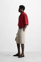 PLEATED WIDE FIT BERMUDA SHORTS