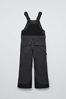 WATER REPELLENT AND WINDPROOF RECCO® SYSTEM SUSPENDERS JUMPSUIT SKI COLLECTION