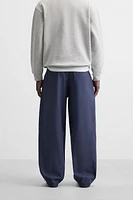 RELAXED FIT PLEATED PANTS