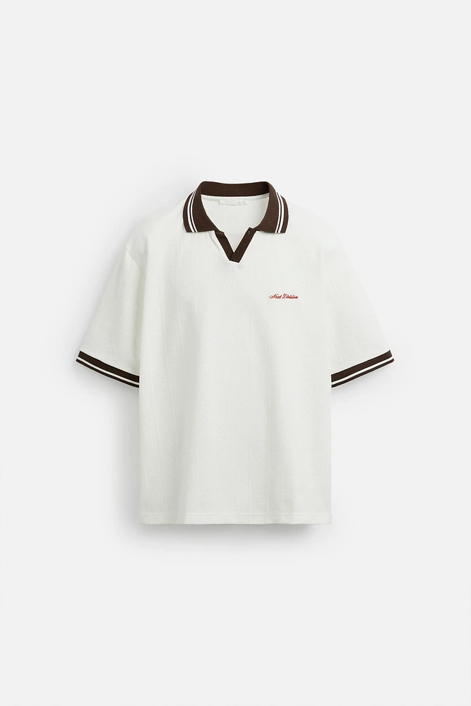 POLO JACQUARD INSCRIPTION BRODÉE