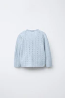 GILET EN MAILLE CROISÉ AJOURÉ