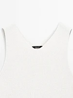Knit dress with fringed hem