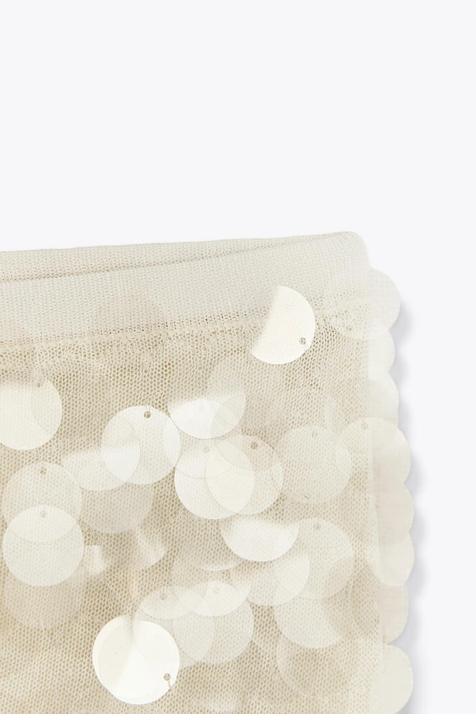 MINI-JUPE EN MAILLE À SEQUINS