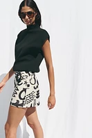 PRINTED BUCKLE MINI SKIRT