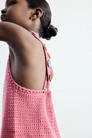 SALOPETTE COURTE EN MAILLE CROCHET FLEURS