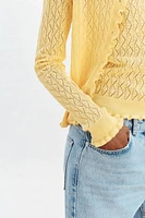GILET EN MAILLE POINTELLE À VOLANTS