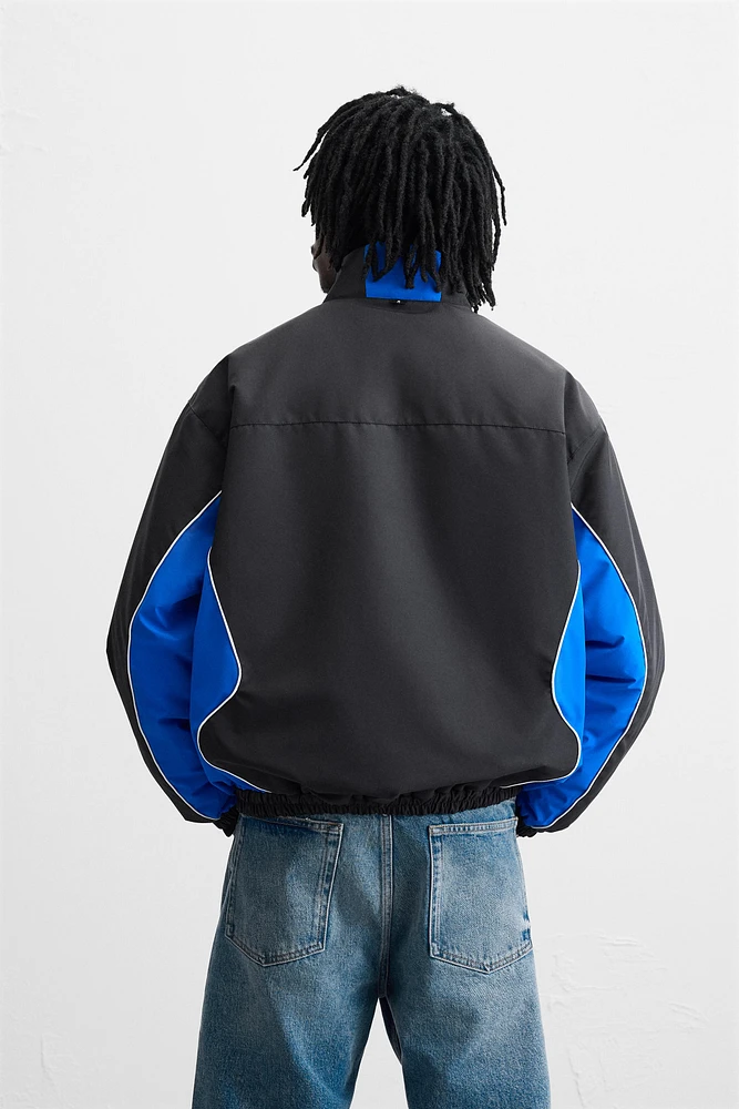 BLOUSON TECHNIQUE AVEC BLOCS DE COULEUR