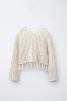 PULL EN MAILLE RÉSILLE À FRANGES
