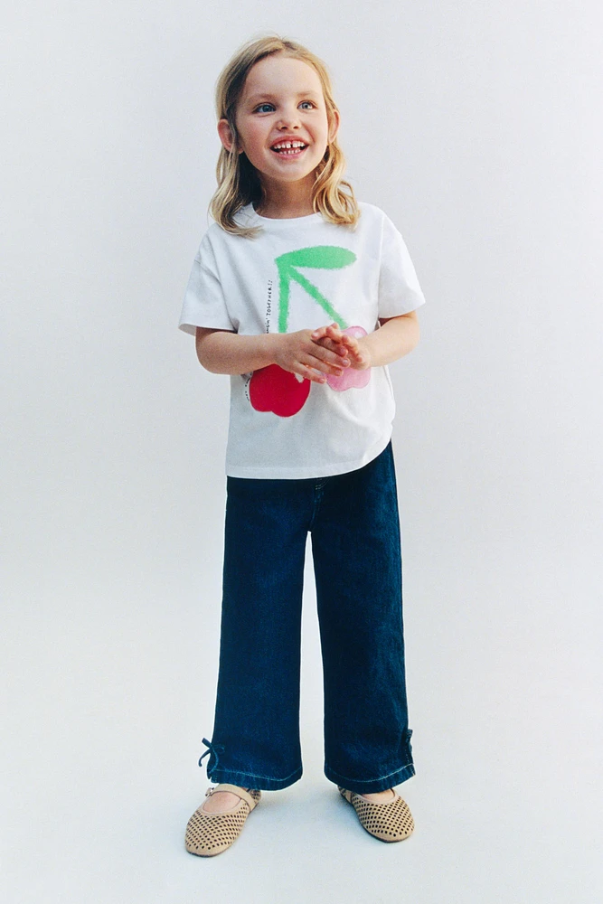 JUPE-CULOTTE EN JEAN À NŒUDS