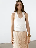Top slim à encolure américaine effiloché