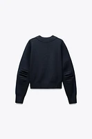 SWEAT EN MAILLE À MANCHES AVEC PLIS