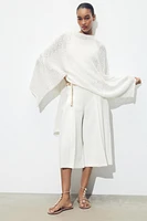 BELTED PLEATED LONG SHORTS