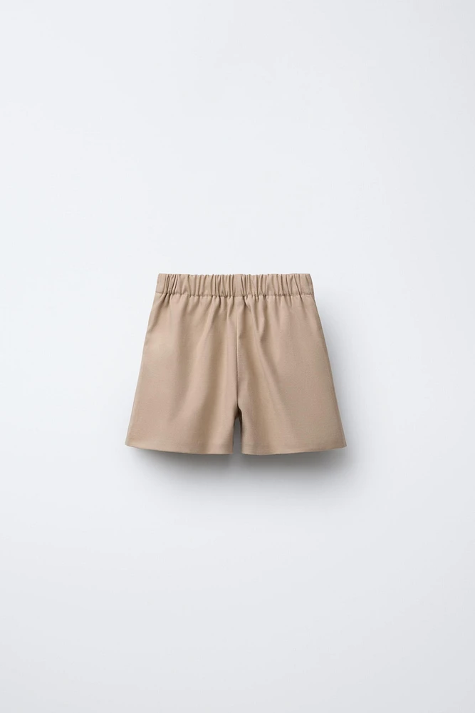 JUPE-SHORT À NŒUDS