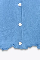 TOP EN MAILLE À VOLANT