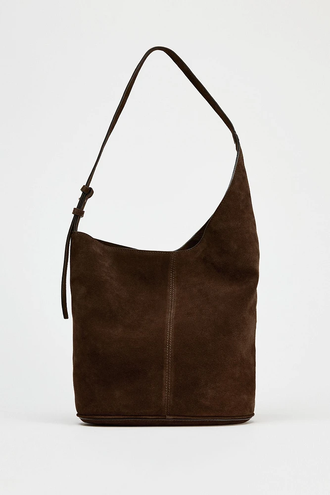 ASYMMETRIC SOFT SPLIT LEATHER BUCKET BAG