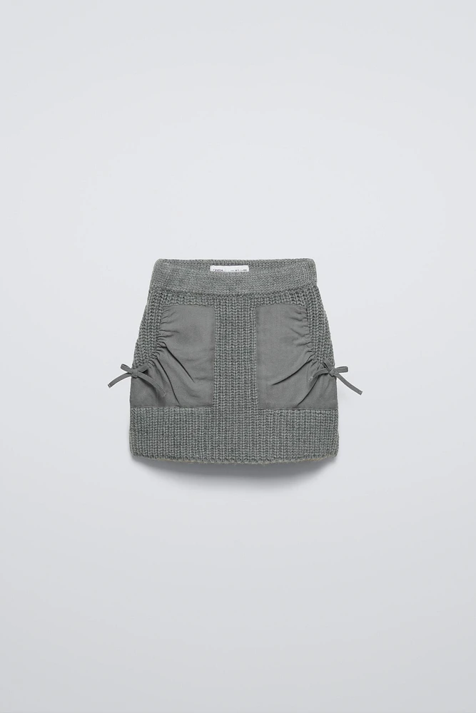 KNIT SKIRT WITH COMBINATION POCKETS