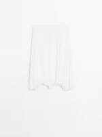 Pleated skirt with godet detail