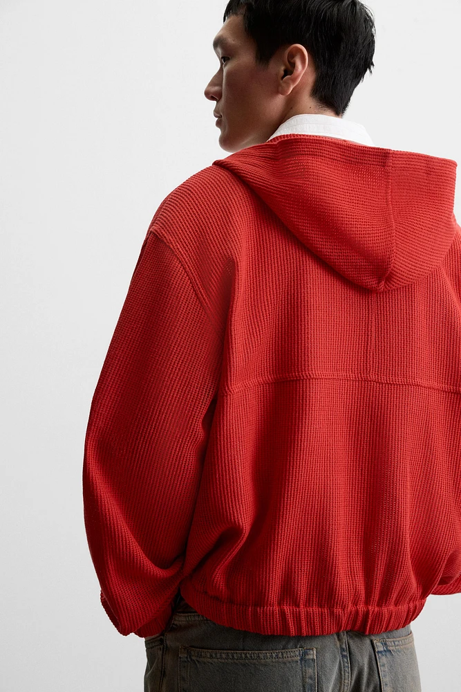 VESTE STRUCTURE OUVERTE CAPUCHE