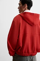 VESTE STRUCTURE OUVERTE CAPUCHE