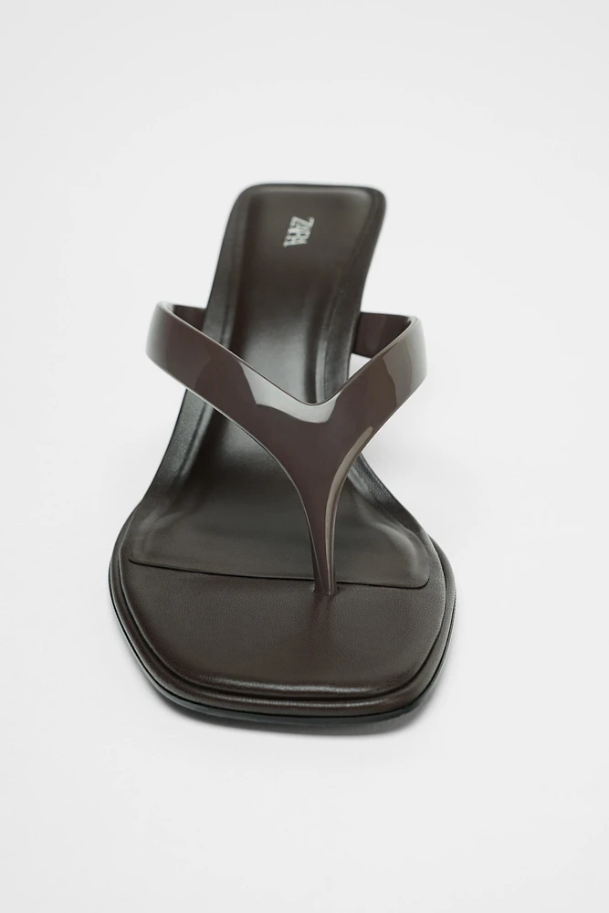 ASYMMETRIC HEELED SANDALS