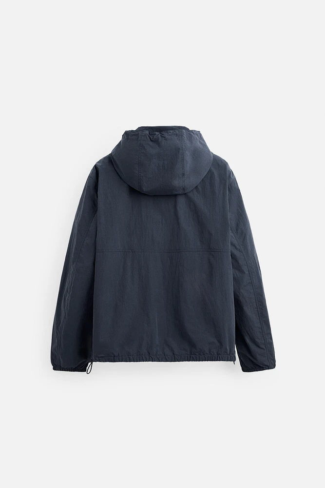 BLOUSON TECHNIQUE À CAPUCHE