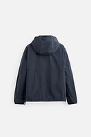 BLOUSON TECHNIQUE À CAPUCHE