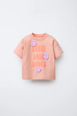 TEXT AND FLOWER APPLIQUÉ T-SHIRT