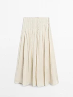 Flowing midi skirt with box pleats