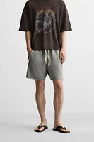 BERMUDA RELAXED FIT DÉLAVÉ