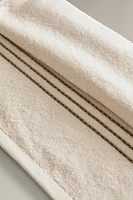 SERVIETTE DE BAIN COUTURE CONTRASTANTE