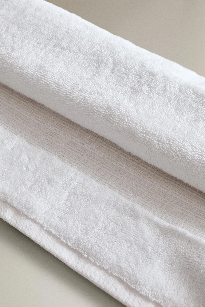 METALLIC THREAD BATH TOWEL WITH BORDER