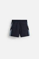 CONTRAST BANDS MID-LENGTH SWIMSUIT