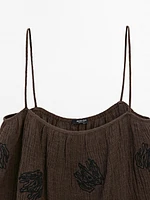 Flowing textured top with embroidered detail