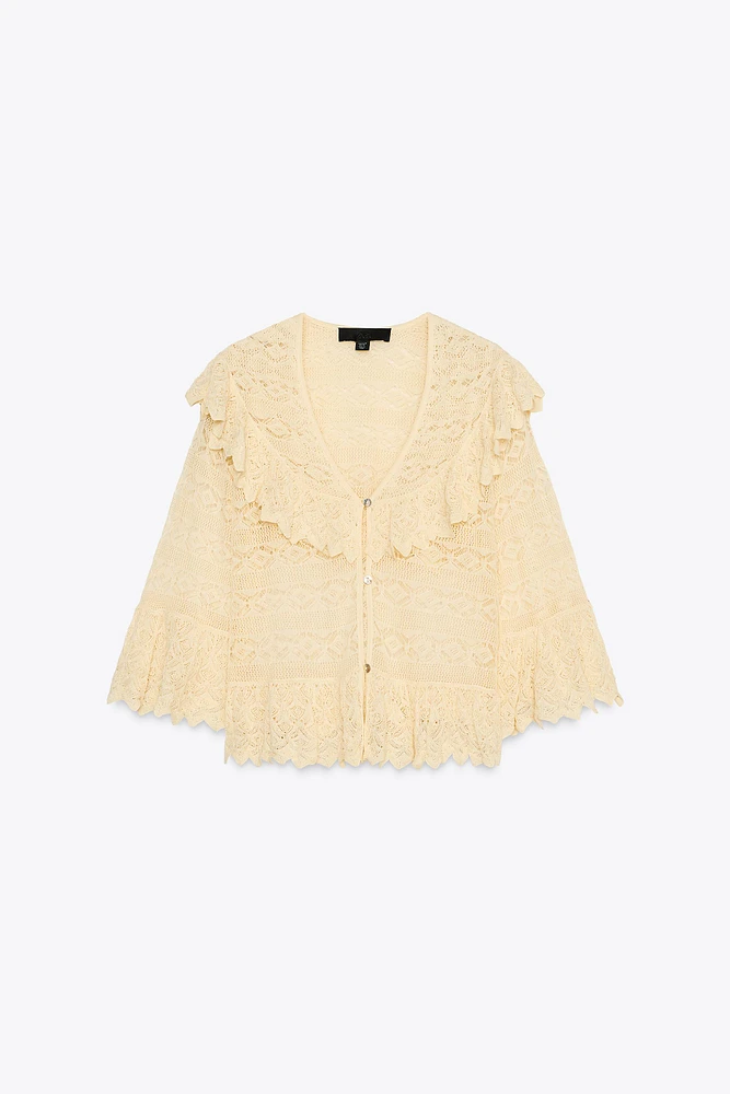 BLOUSE EN MAILLE POINTELLE À VOLANTS