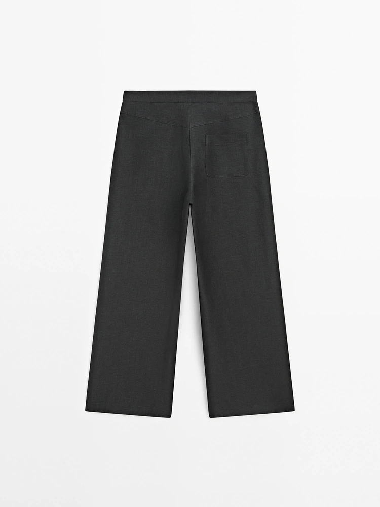 Flowing wide-leg trousers with seam details