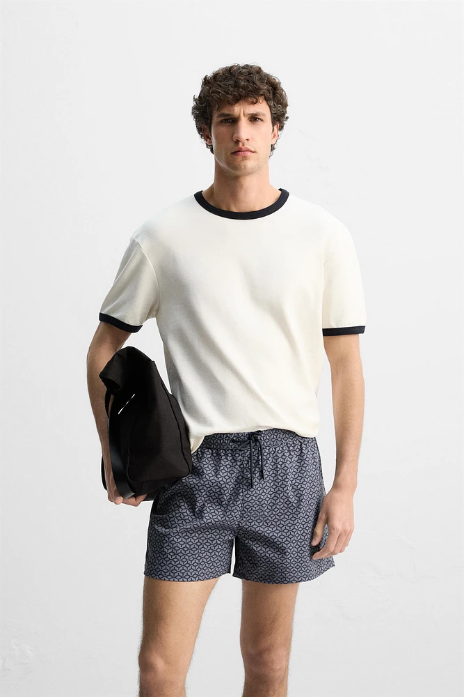 GEOMETRIC PRINT SHORT SWIMMING TRUNKS