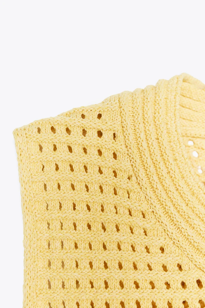 TOP EN MAILLE QUADRILLÉ À FRANGES