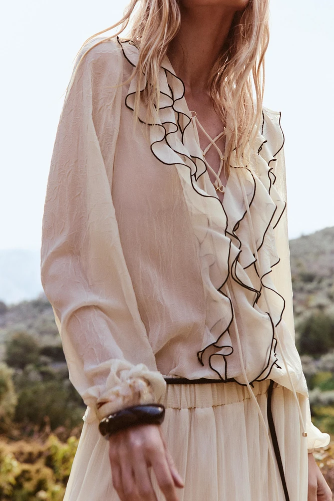 SEMI-SHEER BLOUSE WITH RUFFLES
