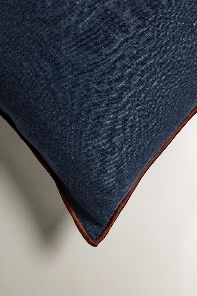 HOUSSE DE COUSSIN OVERLOCK
