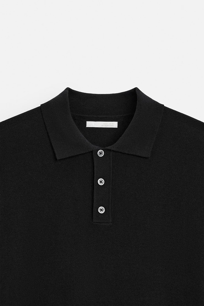 Knit polo shirt viscose blend fabric. Lapel collar with front button closure. Short sleeves. Side vents at hem. Rib trim.