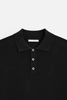 Knit polo shirt viscose blend fabric. Lapel collar with front button closure. Short sleeves. Side vents at hem. Rib trim.