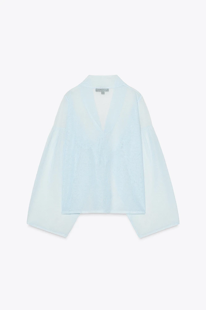 BLOUSE SEMI-TRANSPARENTE EN MAILLE