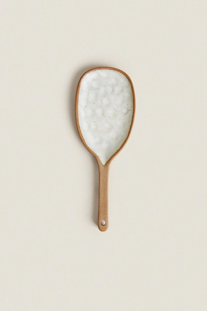 SPOON WITH RAISED DESIGN