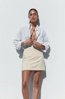 MINI SKIRT WITH FRAYED EMBROIDERY