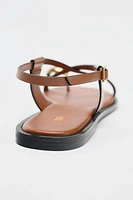 FLAT SANDALS WITH STRAPS AND METAL DETAIL