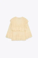 BLOUSE EN MAILLE POINTELLE À VOLANTS