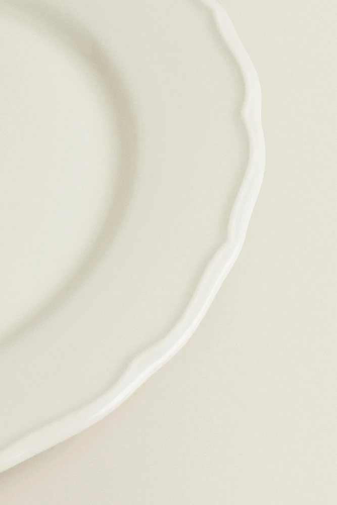 EARTHENWARE DINNER DISH WITH RAISED-DESIGN EDGE