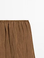 Lightweight pleated skirt with elasticated waistband