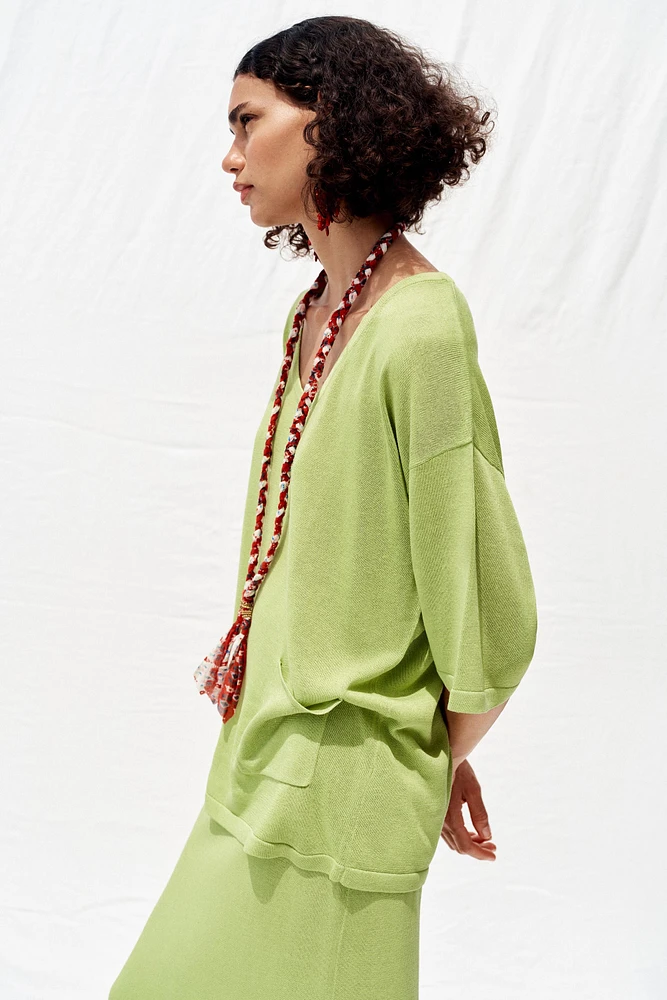 TOP OVERSIZE EN MAILLE MANCHES COURTES