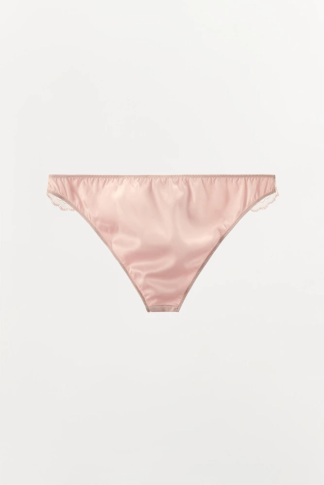 CULOTTE EN MATIÈRES VARIÉES BRODÉES